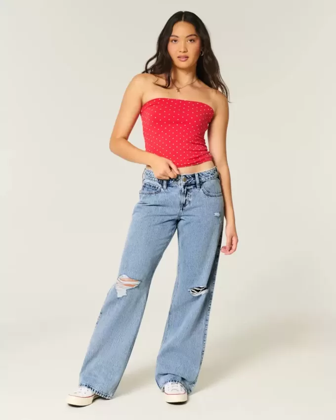 Jeans larghi a vita bassa e lavaggio medio con strappi curvy