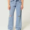 Jeans larghi a vita bassa e lavaggio medio con strappi curvy
