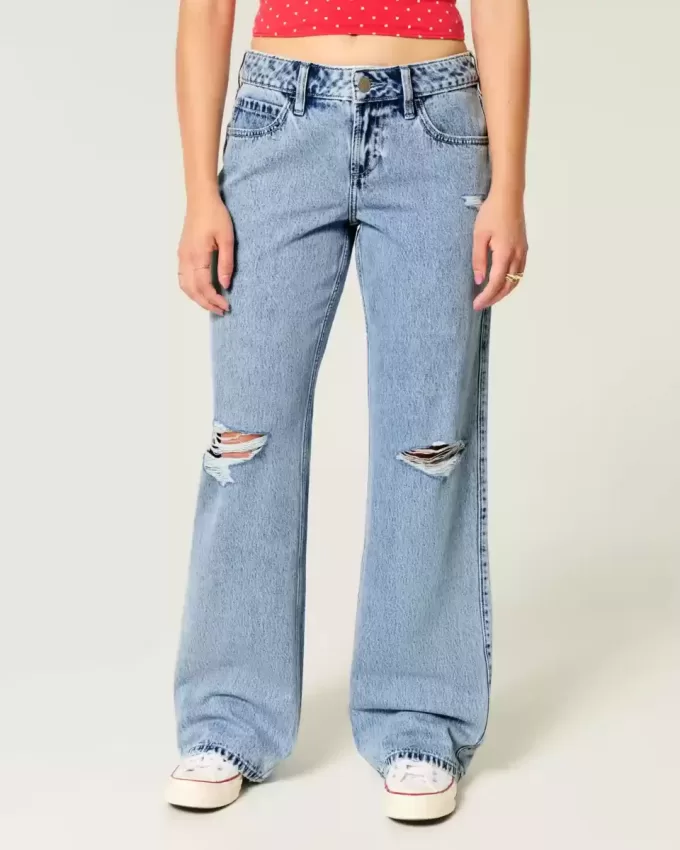 Jeans larghi a vita bassa e lavaggio medio con strappi curvy