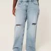 Jeans larghi a vita bassa e lavaggio medio con strappi curvy Jeans larghi a vita bassa e lavaggio medio con strappi curvy