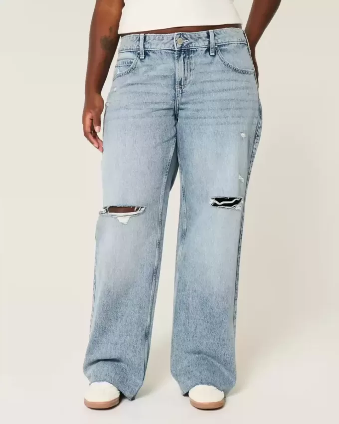 Jeans larghi a vita bassa e lavaggio medio con strappi curvy Jeans larghi a vita bassa e lavaggio medio con strappi curvy