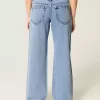 Jeans larghi a vita bassa e lavaggio medio con strappi curvy