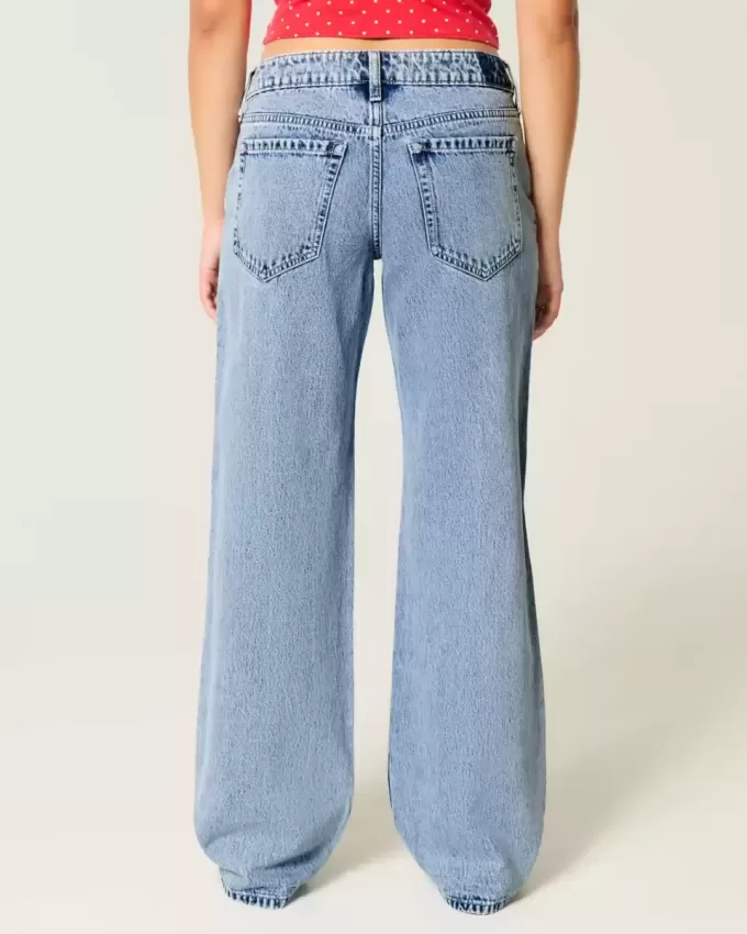 Jeans larghi a vita bassa e lavaggio medio con strappi curvy