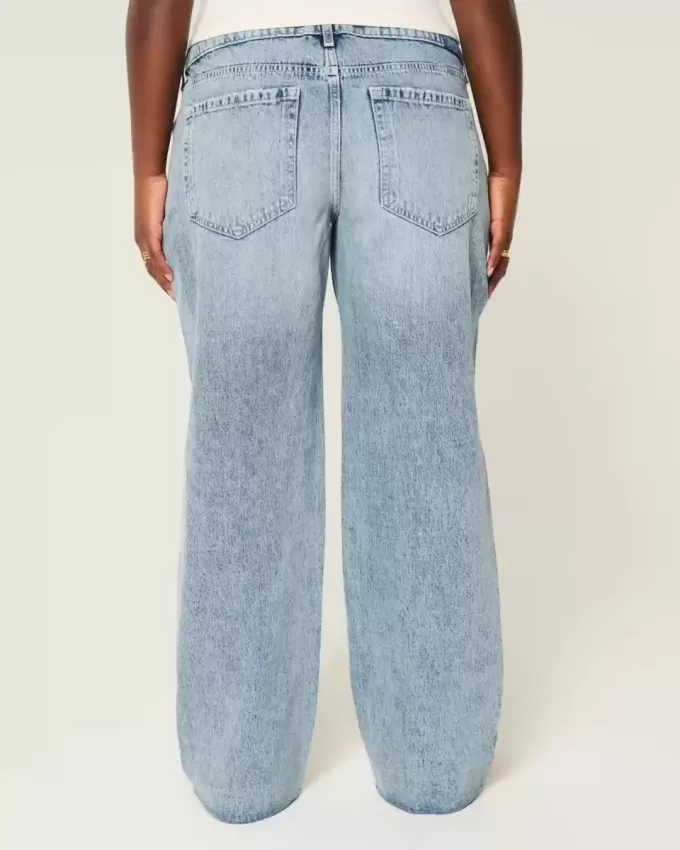 Jeans larghi a vita bassa e lavaggio medio con strappi curvy Jeans larghi a vita bassa e lavaggio medio con strappi curvy