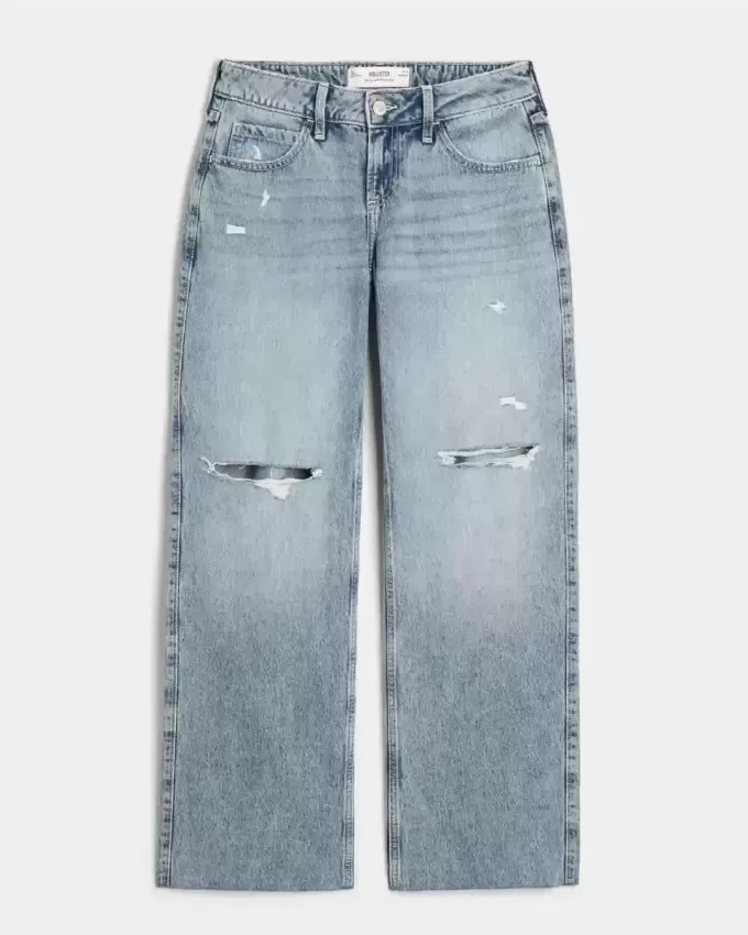 Jeans larghi a vita bassa e lavaggio medio con strappi curvy Jeans larghi a vita bassa e lavaggio medio con strappi curvy