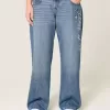Jeans larghi a vita bassa e lavaggio scuro, modello Class of ’26, ricamati