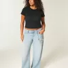 Jeans larghi a vita bassa effetto consumato