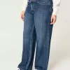 Jeans larghi a vita media e lavaggio scuro con effetto curvy