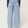 Jeans larghi affusolati a vita bassa con lavaggio chiaro