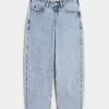 Jeans larghi affusolati a vita bassa con lavaggio chiaro