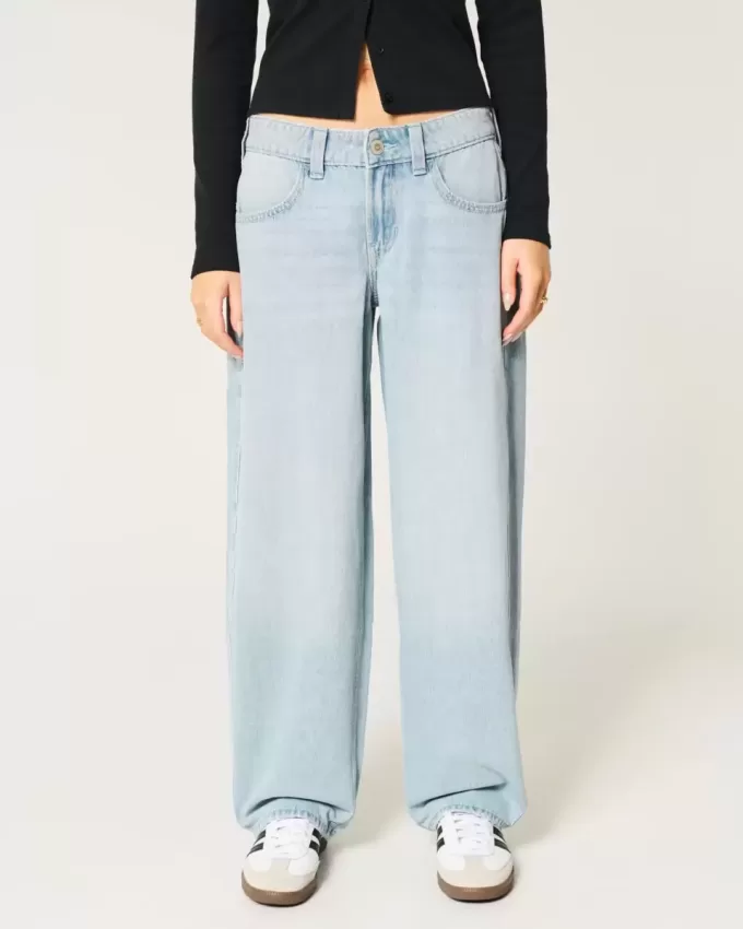 Jeans larghi affusolati a vita bassa con lavaggio medio Jeans larghi affusolati a vita bassa con lavaggio medio