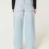 Jeans larghi affusolati a vita bassa con lavaggio medio Jeans larghi affusolati a vita bassa con lavaggio medio