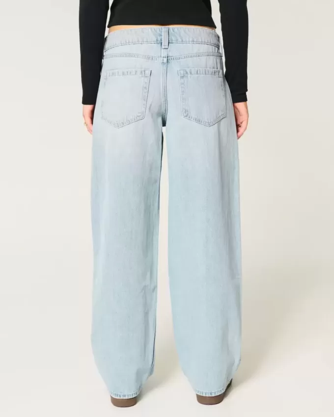 Jeans larghi affusolati a vita bassa con lavaggio medio Jeans larghi affusolati a vita bassa con lavaggio medio