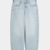 Jeans larghi affusolati a vita bassa con lavaggio medio Jeans larghi affusolati a vita bassa con lavaggio medio