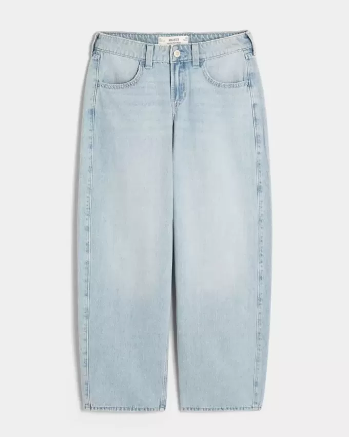 Jeans larghi affusolati a vita bassa con lavaggio medio Jeans larghi affusolati a vita bassa con lavaggio medio