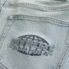 Jeans larghi con grafica Downforce Racing Light Wash