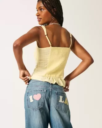 Jeans larghi con grafica Los Angeles a lavaggio medio e vita bassa