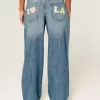 Jeans larghi con grafica Los Angeles a lavaggio medio e vita bassa