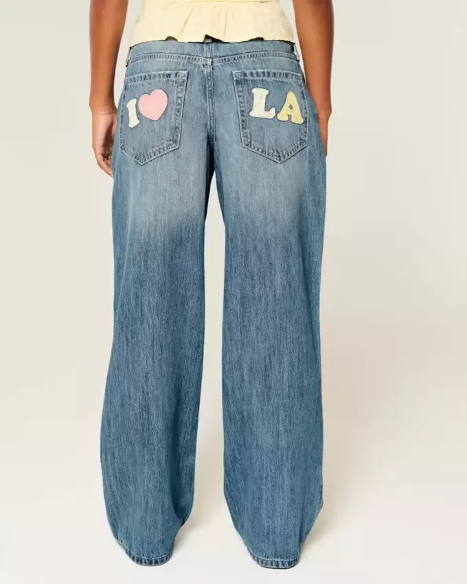 Jeans larghi con grafica Los Angeles a lavaggio medio e vita bassa