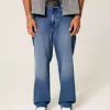 Jeans larghi con grafica rosa lavaggio scuro
