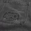 Jeans larghi con logo grafico nero lavato