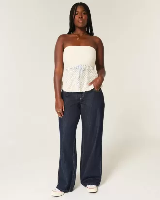 Jeans larghi con risvolto e vita bassa e lavaggio scuro