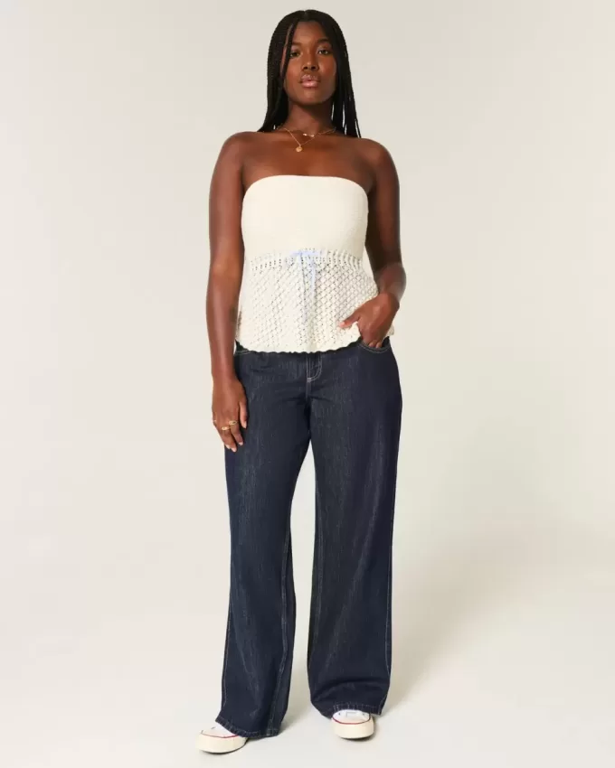 Jeans larghi con risvolto e vita bassa e lavaggio scuro