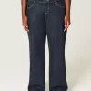 Jeans larghi con risvolto e vita bassa e lavaggio scuro