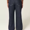 Jeans larghi con risvolto e vita bassa e lavaggio scuro
