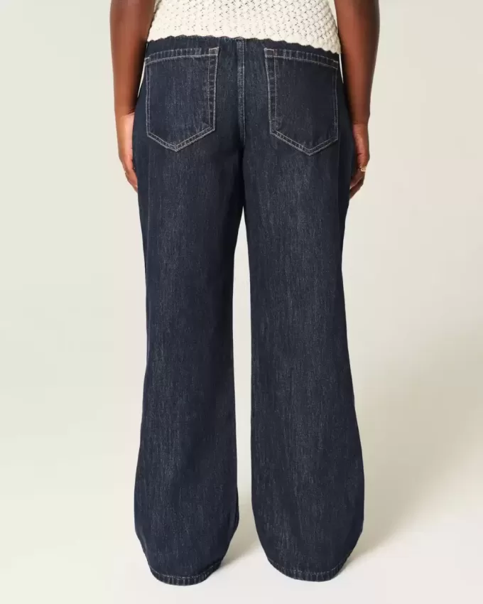 Jeans larghi con risvolto e vita bassa e lavaggio scuro