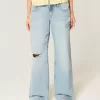 Jeans larghi con stampa grafica e lavaggio chiaro strappati a vita bassa