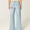 Jeans larghi con stampa grafica e lavaggio chiaro strappati a vita bassa