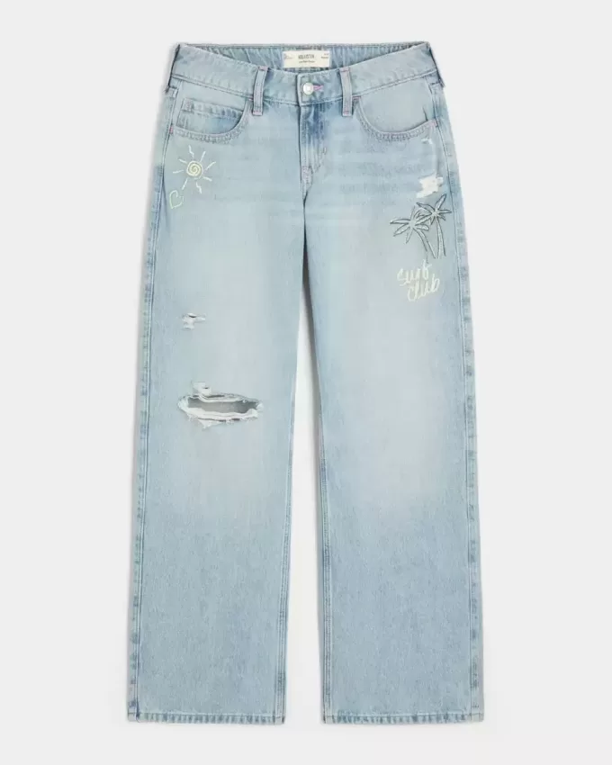 Jeans larghi con stampa grafica e lavaggio chiaro strappati a vita bassa