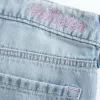 Jeans larghi con stampa grafica e lavaggio chiaro strappati a vita bassa