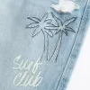 Jeans larghi con stampa grafica e lavaggio chiaro strappati a vita bassa