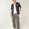 Jeans larghi da pittore stile skater mimetico
