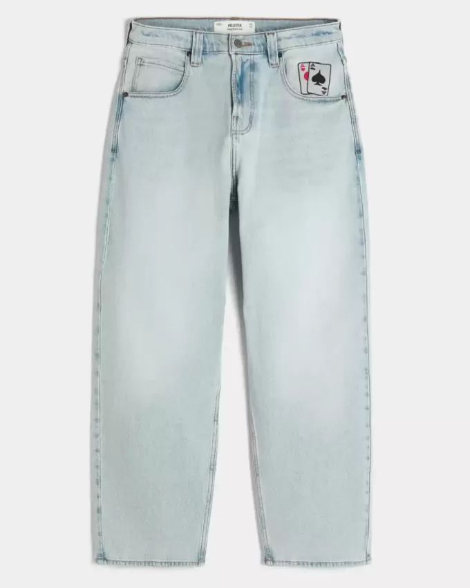 Jeans larghi da skater con grafica di carte da gioco e lavaggio chiaro