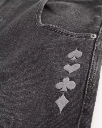 Jeans larghi da skater con grafica Joker e carte da gioco nere lavate