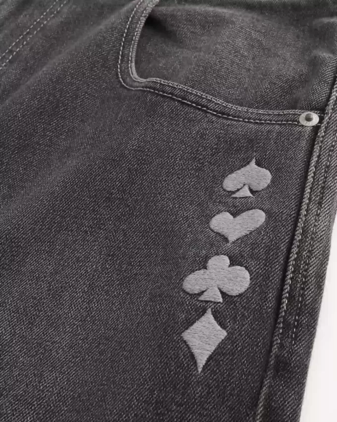 Jeans larghi da skater con grafica Joker e carte da gioco nere lavate