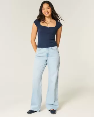 Jeans larghi e a vita alta con lavaggio chiaro
