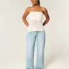 Jeans larghi e strappati a vita bassa e curvy