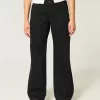 Jeans larghi neri a vita bassa e curvy Jeans larghi neri a vita bassa e curvy