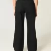 Jeans larghi neri a vita bassa e curvy Jeans larghi neri a vita bassa e curvy