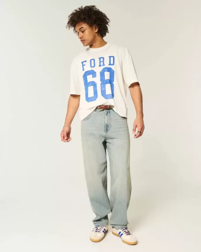 Jeans larghi skater con dadi ricamati e lavaggio chiaro