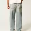 Jeans larghi skater con dadi ricamati e lavaggio chiaro
