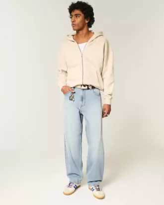 Jeans larghi skater con lavaggio chiaro ricamati