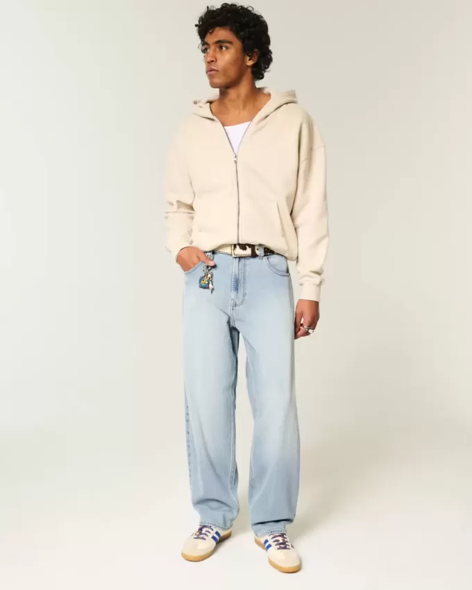Jeans larghi skater con lavaggio chiaro ricamati