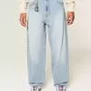 Jeans larghi skater con lavaggio chiaro ricamati