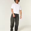Jeans larghi skater con ricamo serpente nero lavato