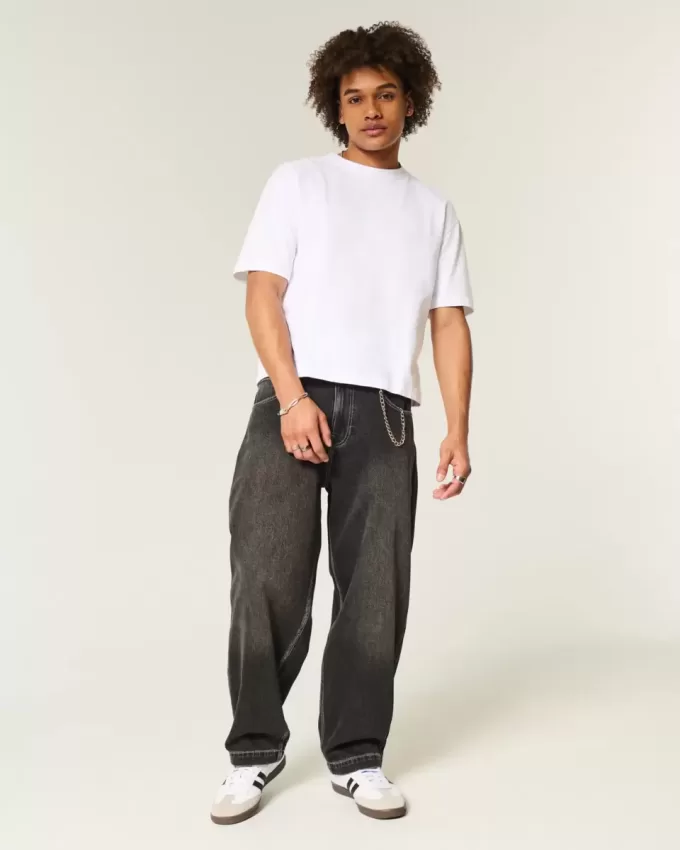 Jeans larghi skater con ricamo serpente nero lavato